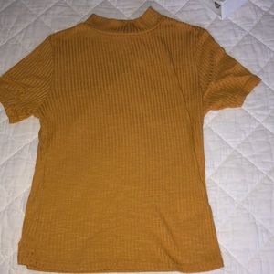 A mustard yellow short sleeved T-shirt